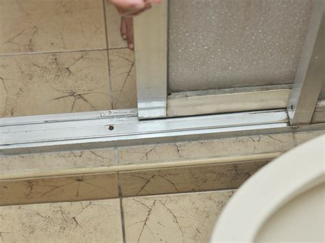 sliding shower door leaks at bottom|How To Fix A Shower Door That Leaks At The Bottom